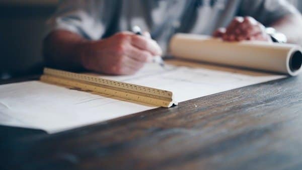 contractor checking blueprints and plans